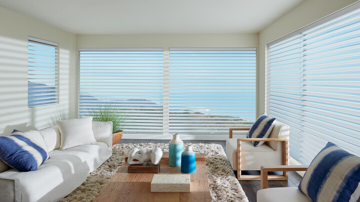 blinds in seating area window treatments in coastal light and airy living area